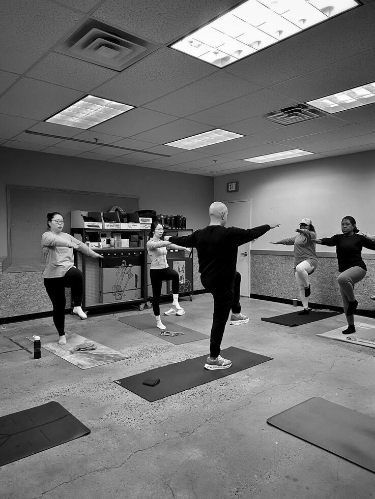 Balance & Stability Attendees working on standing balance and core stability exercises during a Pilates class