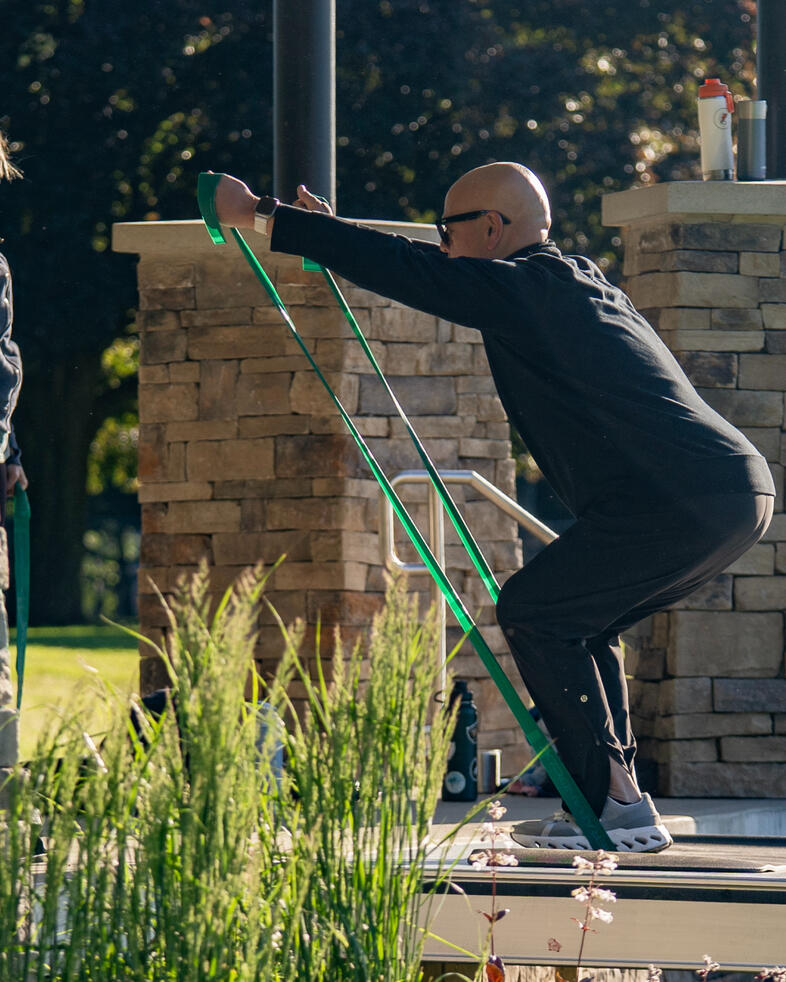Demonstration & Instruction Rafael Jimenez demonstrating a resistance band exercise at Brookdale Park.