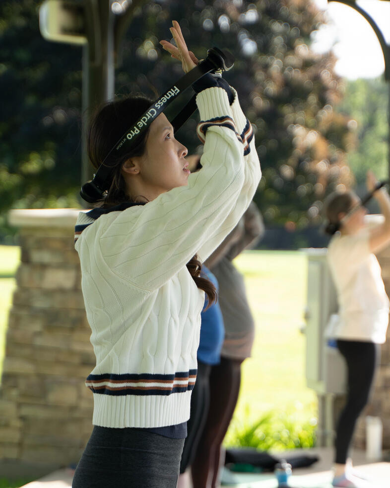 Neck Stretch Participants using a Pilates ring to stretch the neck and upper spine.