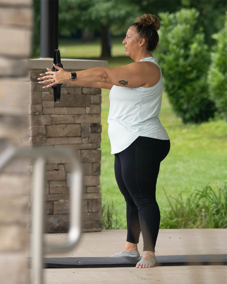 Participant performing standing footwork with ring.