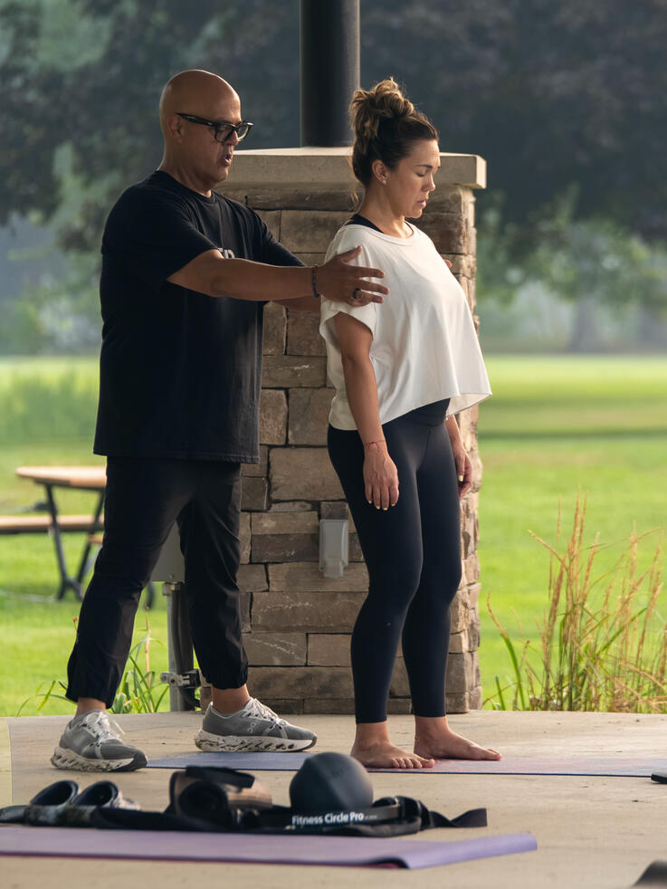 Rafael helping participant find their center. Brookdale Park, Bloomfield, NJ.
