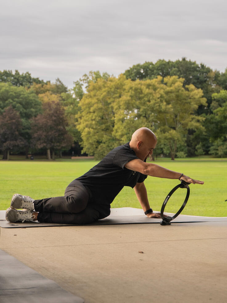 Instructor demonstrating lateral and rotational movement using the ring.